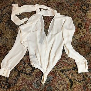 Never worn Bebe bow tie neck bodysuit